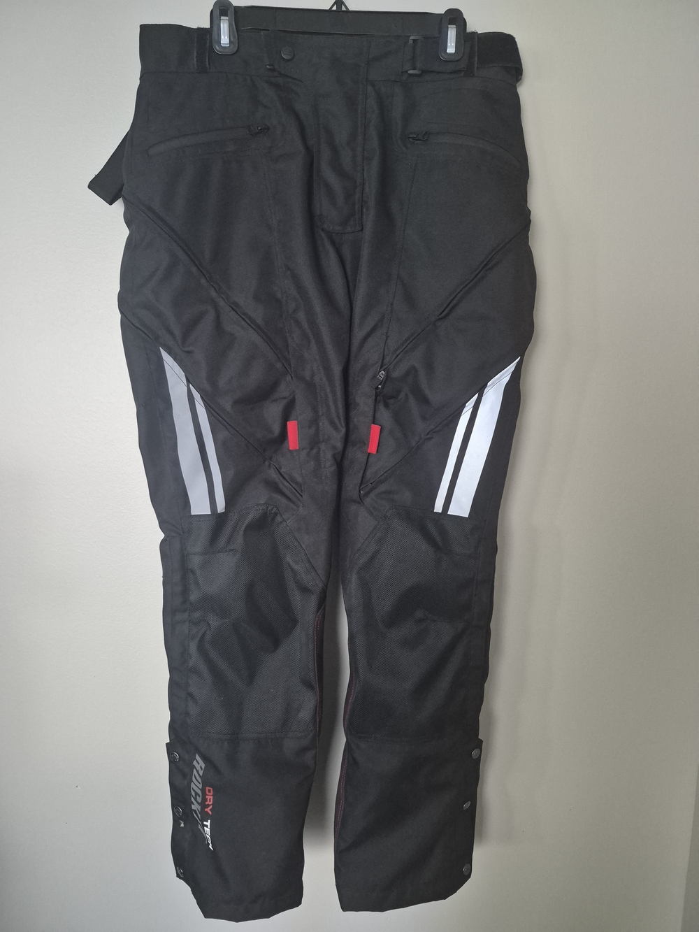 Joe Rocket Black Motorcycle Pants with Reflective Stripes and Red Accents